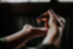 Female hands adding a drop of scented oil to her hands