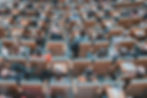 Overhaed view of lecture hall seating filled with students
